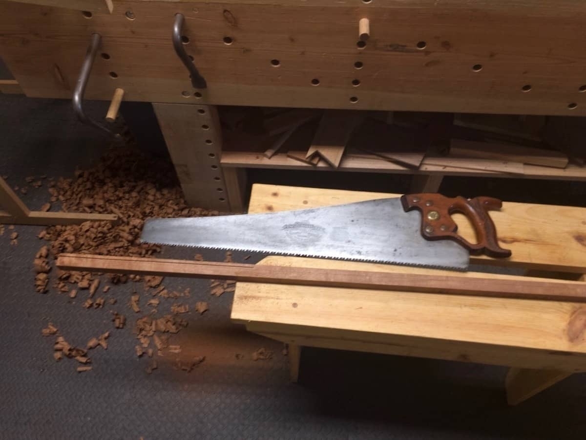 A rip saw and a thin strip of sapele